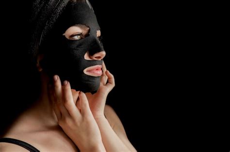 Premium Photo Beautiful Woman Applying Black Facial Mask Beauty