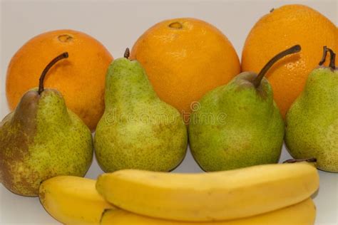 Oranges Pears And Bananas On A White Isolated Background Stock Photo