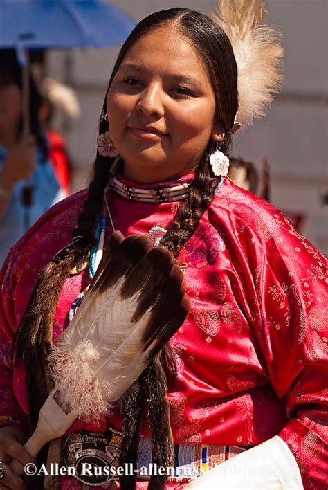 traditional dancer at crow fair powwow with eagle fan on crow indian reservation in montana