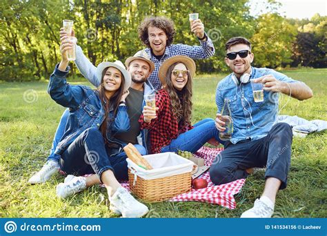 A Group Of Young People Having On A Picnic In The Park. Stock Photo ...