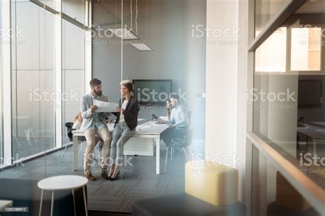 Group Of Coworkers Working Together On Business Project In Modern