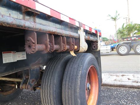 A flatbed has a solid bed, usually of wooden planks. Single Axle Flatbed Trailer w/ Wood Deck & Headboard ...