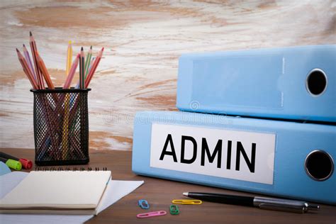 Admin Office Binder On Wooden Desk On The Table Colored