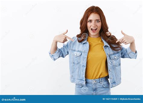 Proud And Sassy Good Looking Redhead Woman In Denim Jacket Smiling Arrogant Pointing Herself