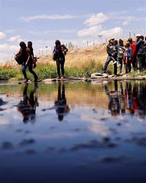 Mexicans Crossing The Border Illegally In Water