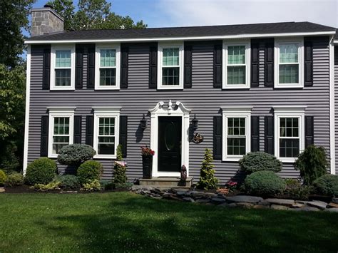 The custom exterior shutters use fixed open louvers to permit seaside breezes into the house. Vinyl Shutters - Project Pictures | Architectural Depot
