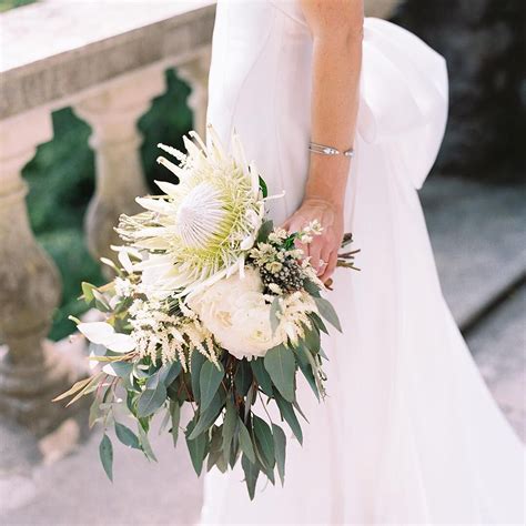 White wedding bouquets & floral designs. white king protea bridal bouquet by Sage Nines Event ...