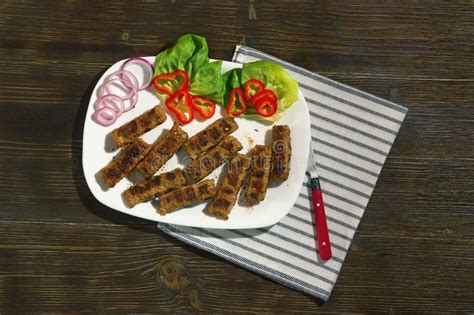 Balkan Cuisine Cevapi Grilled Dish Of Minced Meat With Vegetables