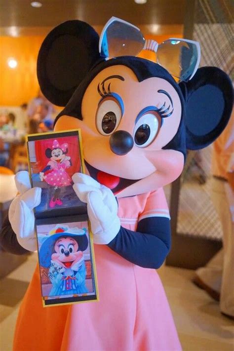 Minnie Sharing Some Of Her Photos To Her Guests Minnie Mouse