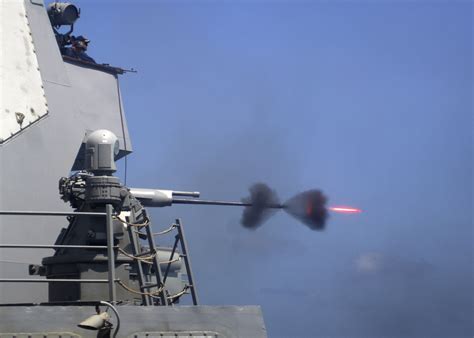 Fileus Navy 110228 N 5838w 004 An Mk 38 25mm Gun System Is Fired