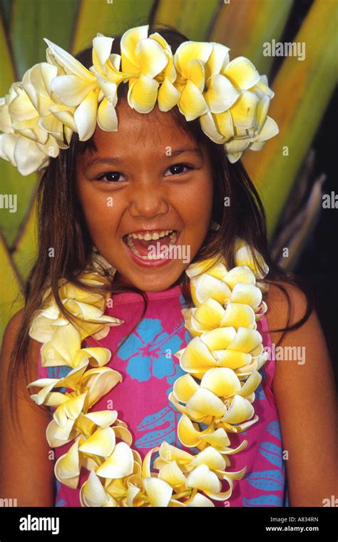 A Young Hawaiian Girl Wearing A Flower Lei Maui Hawaii Stock Photo