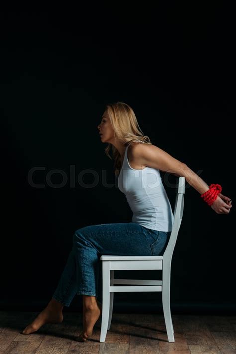 side view of woman with tied hands stock image colourbox