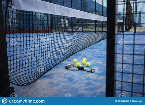 Experter inom racketsport sedan 1875. Racket And Padel Tennis Balls On The Blue Court. Stock Photo - Image of recreation, match: 125622856