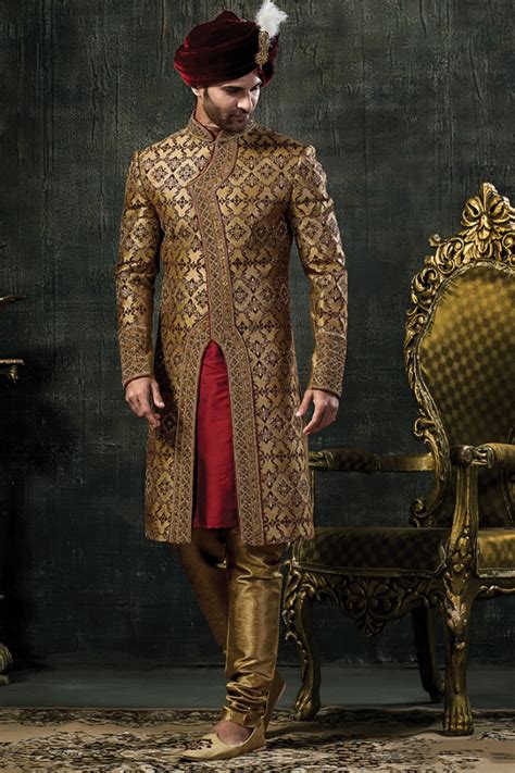 Wedding card gives a sneak peek of the wedding. Mens Golden And Red Colour Wedding Groom Sherwani