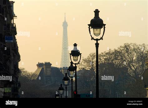 Elegant Street Lamps In The Streets Of Paris With The Eiffel Tower In