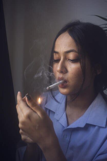 Premium Photo Portrait Of Woman Smoking Cigarette