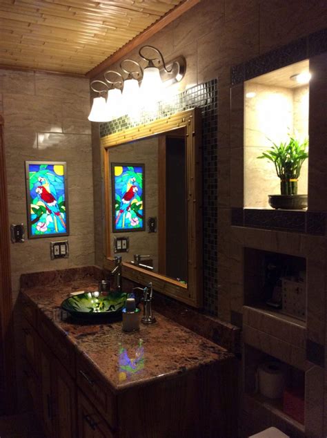 Although some companies make window film from ceramic, laminate, or carbon materials, most film is made of polyester using a polyethylene terephthalate, or pet polymer. Parrot Stained Glass Window Panel Installed In A Bathroom