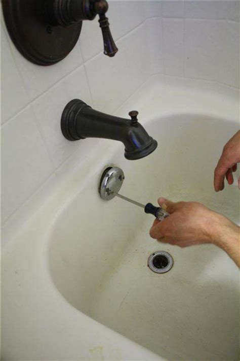 Lift the drain and unscrew the stopper. How to Replace Bathtub Drain Trim Kit | Old bathtub ...