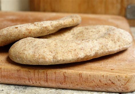 I've found cooking it on the stove is easier, however it results in a shape: Wholemeal Pitta Bread - thelittleloaf