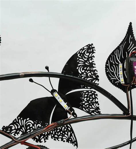 Buy Metal Butterfly On Leaf With Led In Multicolour Wall Art By Malik