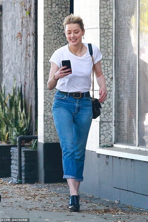 Amber Heard Beams At Her Phone On La Stroll After Johnny Depp Says She