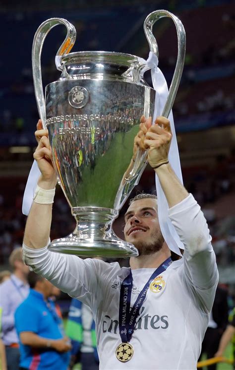 real madrid s gareth bale celebrates with the trophy real madrid football club real madrid