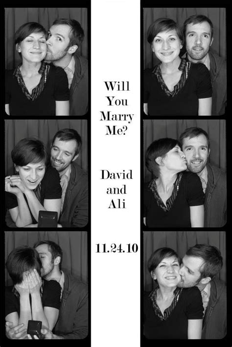 A Couple Kissing Each Other In Black And White Photobooting With The