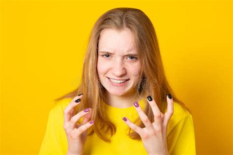 Close Up Isolated Portrait Of Young Annoyed Angry Woman Holding Hands