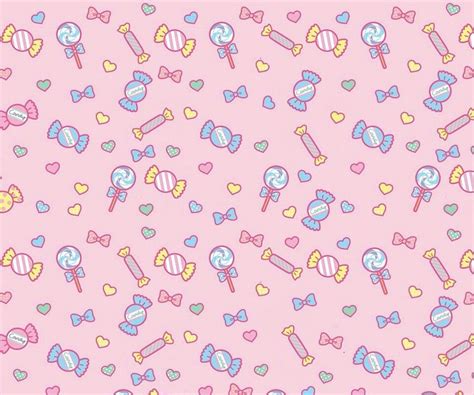 A Pink Background With Candy And Lollipops On It