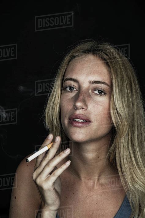 Young Woman Smoking Cigarette Portrait Stock Photo Dissolve