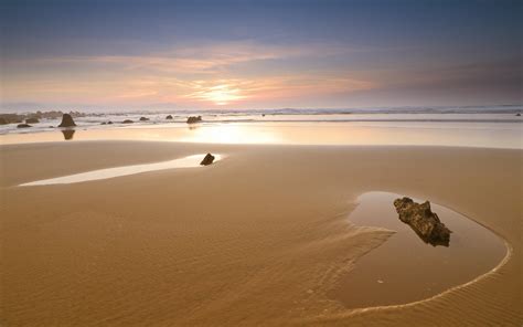 Sunset Sky Beach Sand Stones Sea Hd Wallpaper