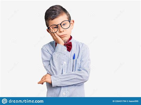 Cute Blond Kid Wearing Nerd Bow Tie And Glasses Thinking Looking Tired