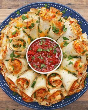 To a large bowl, add cooked shredded chicken, chopped onion, red bell pepper, jalapeño, and taco sauce, stir to combine; Blooming Quesadilla Ring Recipe by Tasty | Recipe | Party ...