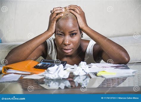 Desperate And Stressed Black Afro American Woman With Calculator And