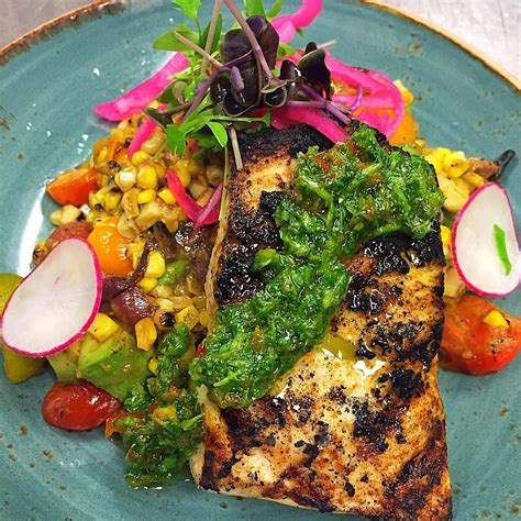 Wood Grilled Amberjack With Sweet Corn Avocado And Heirloom Tomatoes