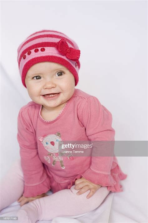 9 Month Old Girl Wearing Pink Clothes Sitting High Res Stock Photo