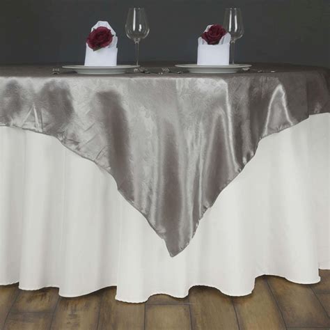 Lily Embossed Satin Table Overlay 72 X 72 Silver Tablecloths