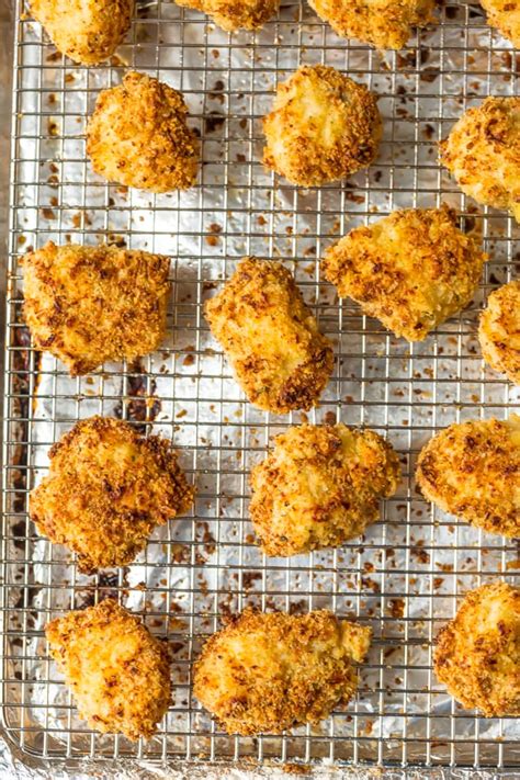 Like a real chicken nugget it is less than a mouthful, not satisfying by itself, and can be warmed up and finished off in. Baked Chicken Nuggets Recipe (VIDEO) - The Cookie Rookie®