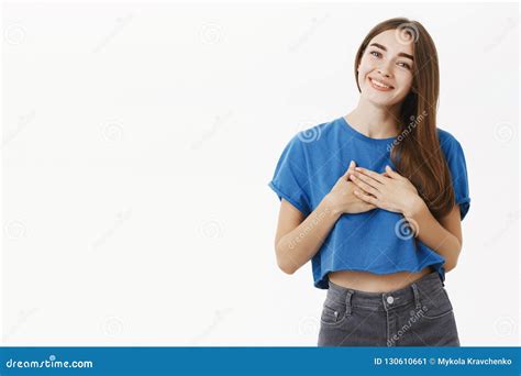 Tender Charming Girlfriend With Brown Hair In Blue T Shirt Holding Palms On Heart In Grateful