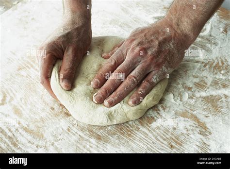 Close Up Of Hands Kneading Dough Stock Photo Alamy