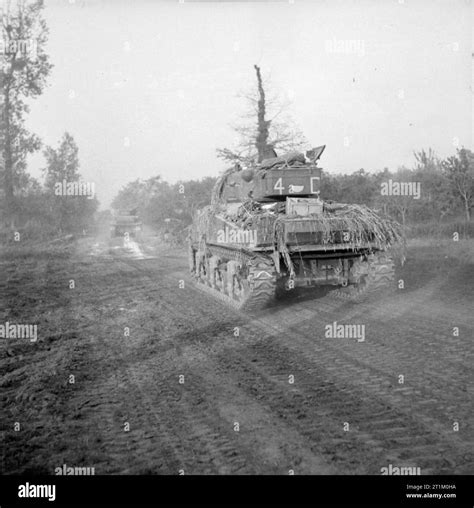 The British Army In Normandy 1944 Sherman Tanks Move Forward To The
