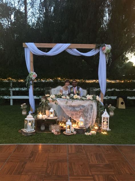 Wedding Sweetheart Table With Eucalyptus Garland And Roses Decorated