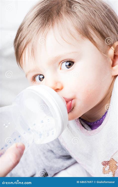 Baby Drinking From A Bottle Stock Image Image Of Enjoyment Drinks