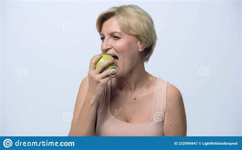 Blonde Middle Aged Woman Eating Ripe Stock Image Image Of Juicy