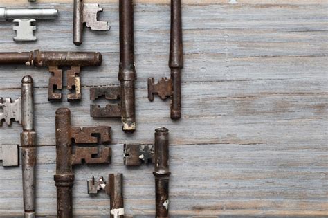 Premium Photo Vintage Old Fashioned Keys On A Rustic Wooden
