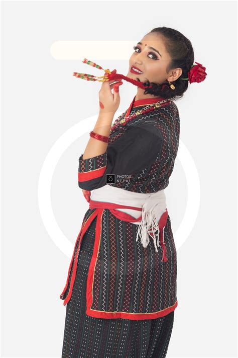 a cute newari girl with a traditional newari outfit poses for camera photos nepal