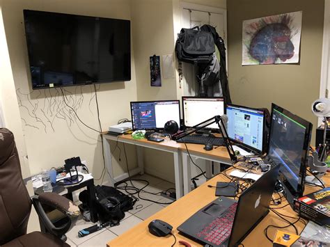 There Are Many Computers On The Desk In This Room