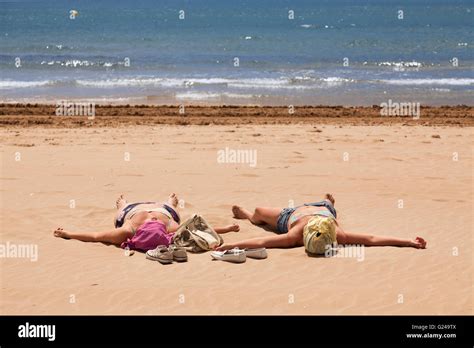 Women Sunbathing On Beach Hi Res Stock Photography And Images Alamy