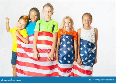 Group Of School Children Holding American National Flag Stock Photo