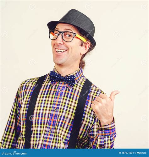 Smiling Nerd Man In Bow Tie And Suspenders Is Showing Thumbs Up Happy